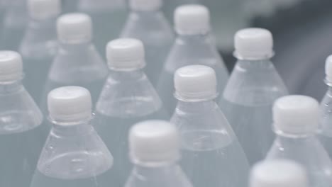 conveyor belt with bottles of drinking water at a modern beverage plant