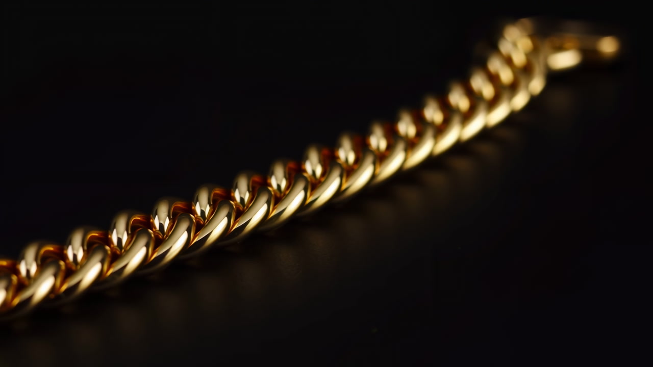 Gold Chain Closeup Gleaming Against Black Backdrop, Macro View Of Polished Links Reflecting Warm Studio