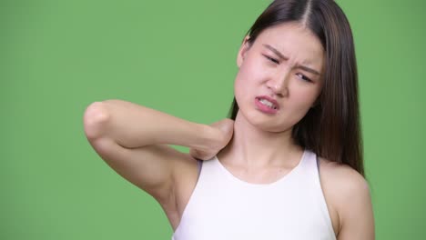 young beautiful asian businesswoman having neck pain