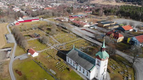 aerial - björketorps church and cemetery, rävlanda, härryda, sweden, wide shot