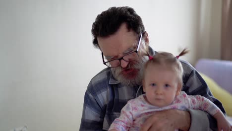 grandfather with a beard wearing glasses