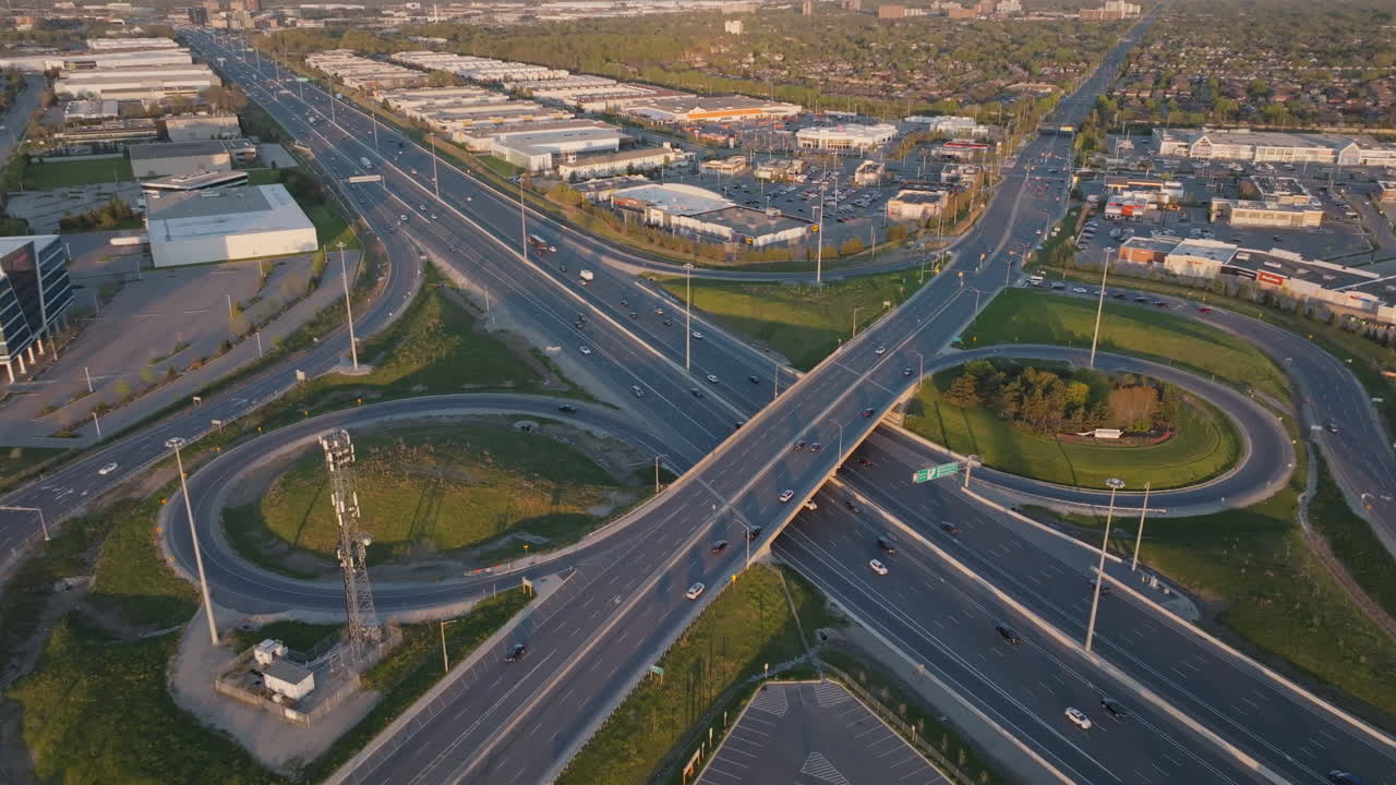 Highway 401 in Mississauga, aerial view of busy roads and curved interchange in slow motion