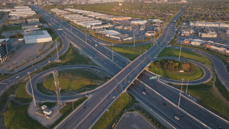 highway 401 in mississauga, aerial view of busy roads and curved interchange in slow motion