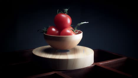 4k abstract levitation platform with tomato on black background