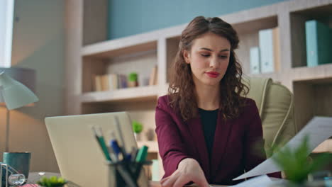 frustrated businesswoman checking documents at buro closeup. manager