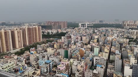 drone shot of circular skywalks in hyderabad’s financial district
