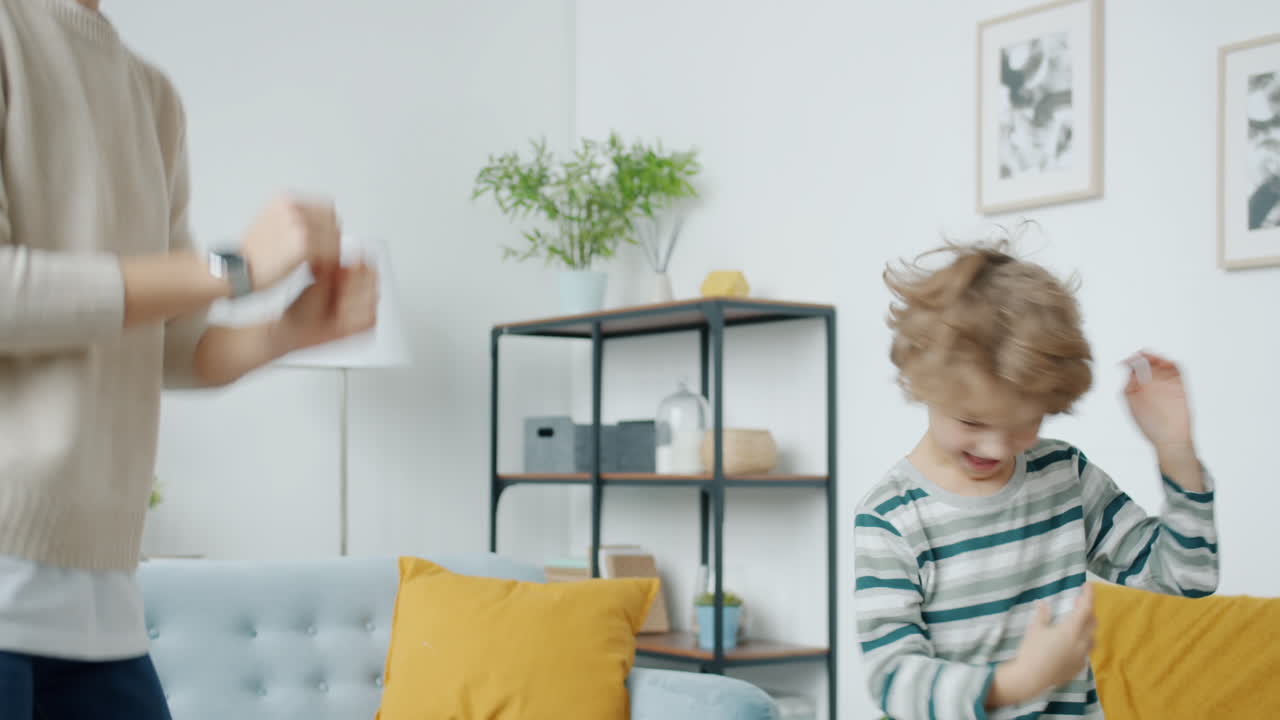 Mother and Son Dancing at Home