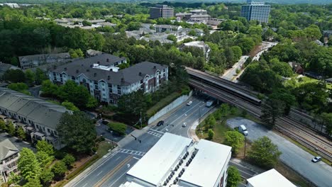 Train-Moving-On-Railway-Passing-By-Apartment-Building-In-Atlanta,-Georgia