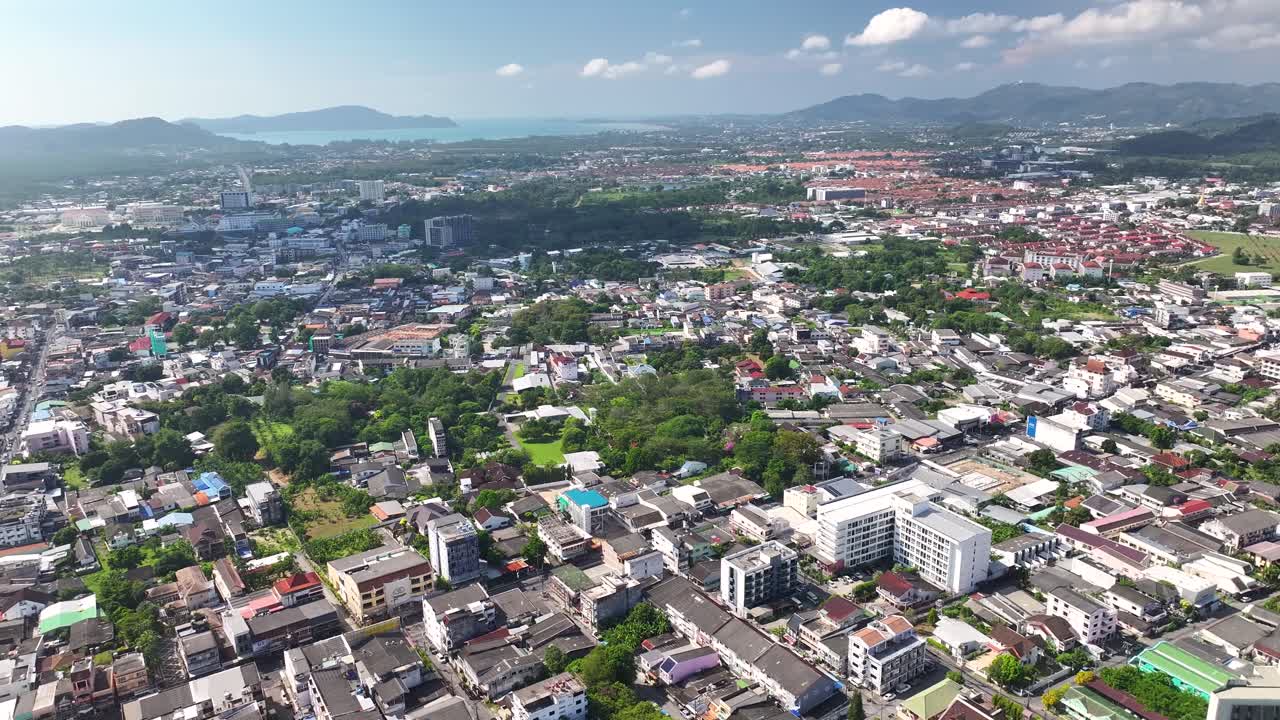 Phuket, Thailand, aerial wide cityscape during sunny day. Landmarks and buildings, coastal on horizon.