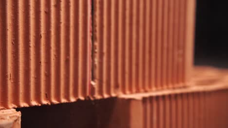 close-up of red bricks in a wall