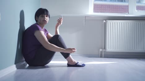 depressed woman talking to camera.