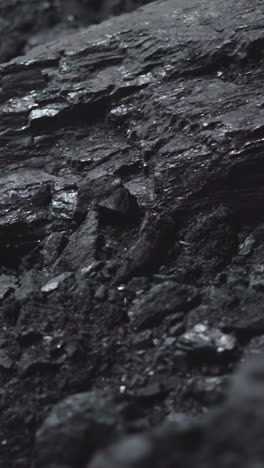 textured charcoal pile in power generating station storage closeup. fossil fuel extraction for industrial purposes. burning rock deposits at plant