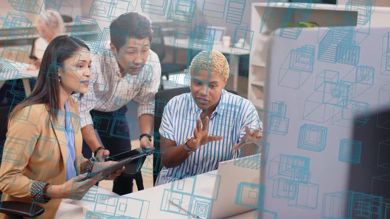 Business team arranging devices and reviewing laptop with tablet blue cube overlay guiding decision