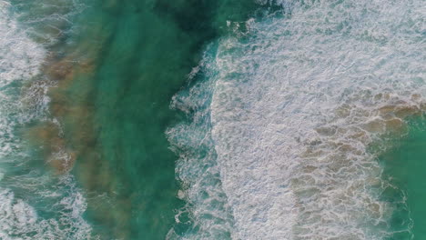 Rising-shot-of-waves-crashing-in-the-ocean