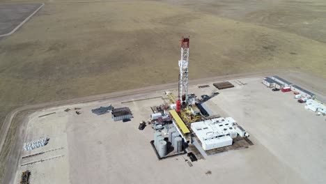 a three hundred foot half orbit of a large drilling operation revealing another rig in the same field