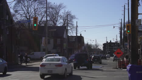 cars-driving-on-non-descript-city-street-in-the-morning-in-fall