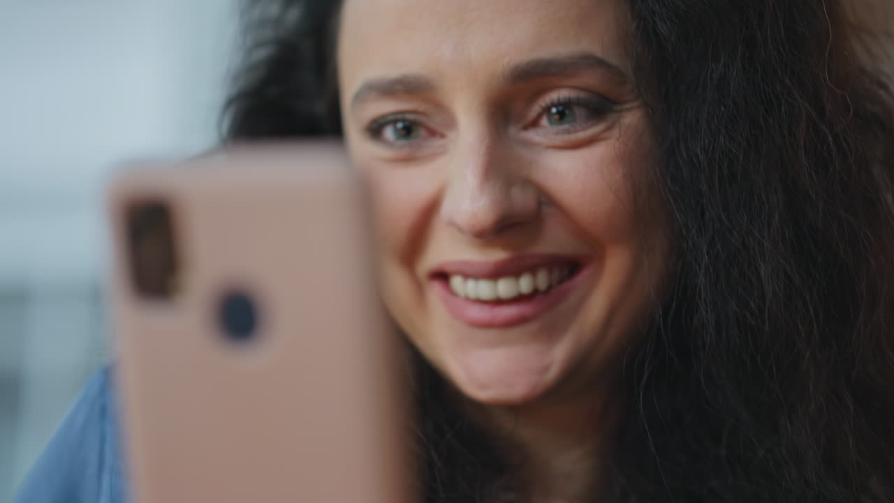 Cheerful woman communicating smartphone closeup. Hands texting mobile phone