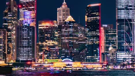 close time lapse of circular quay wharf during vivid festival 2022 while many boats pass sydney, australia