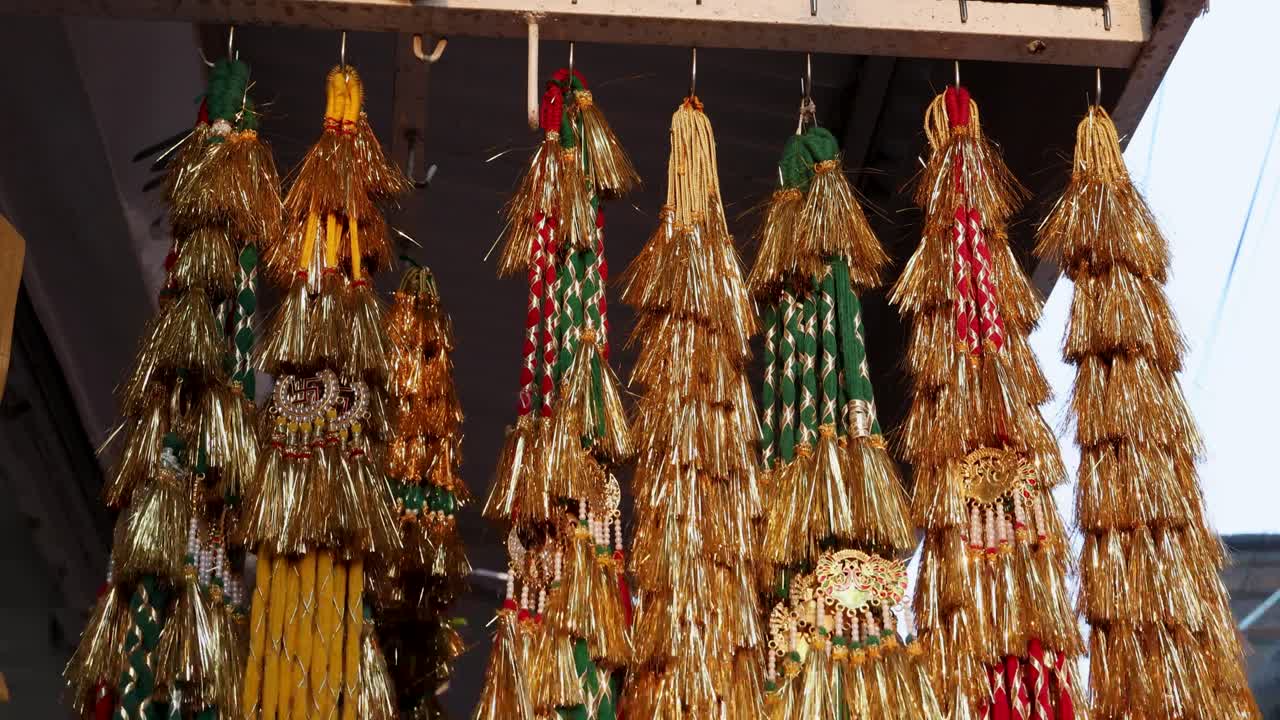 colorful decoration hair thread rajputi paranda kept for sell at festival from flat angle