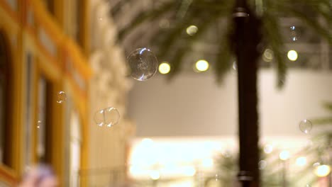 blowing soap bubbles at a children's party.