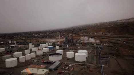 a gloomy winter day along the great salt lake reveals a fuel factory with rising platforms and miles of pipes layout like a puzzle