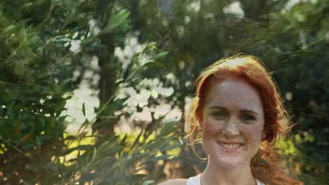 a smiling woman at the park