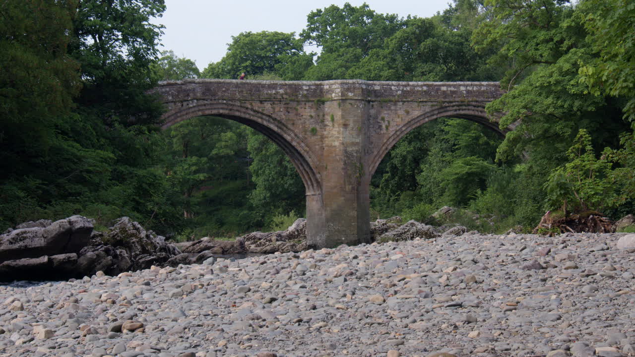 Shot of the Devils bridge from the river Lune with Stanley bridge in background at Kirkby Lonsdale, North Yorkshire