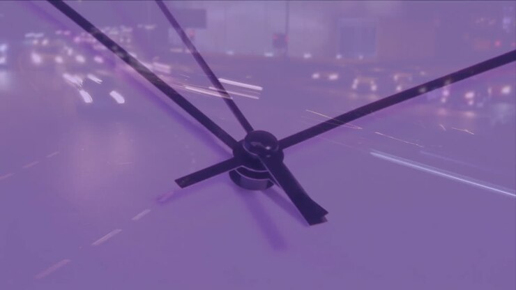 Animation of clock ticking over city traffic background