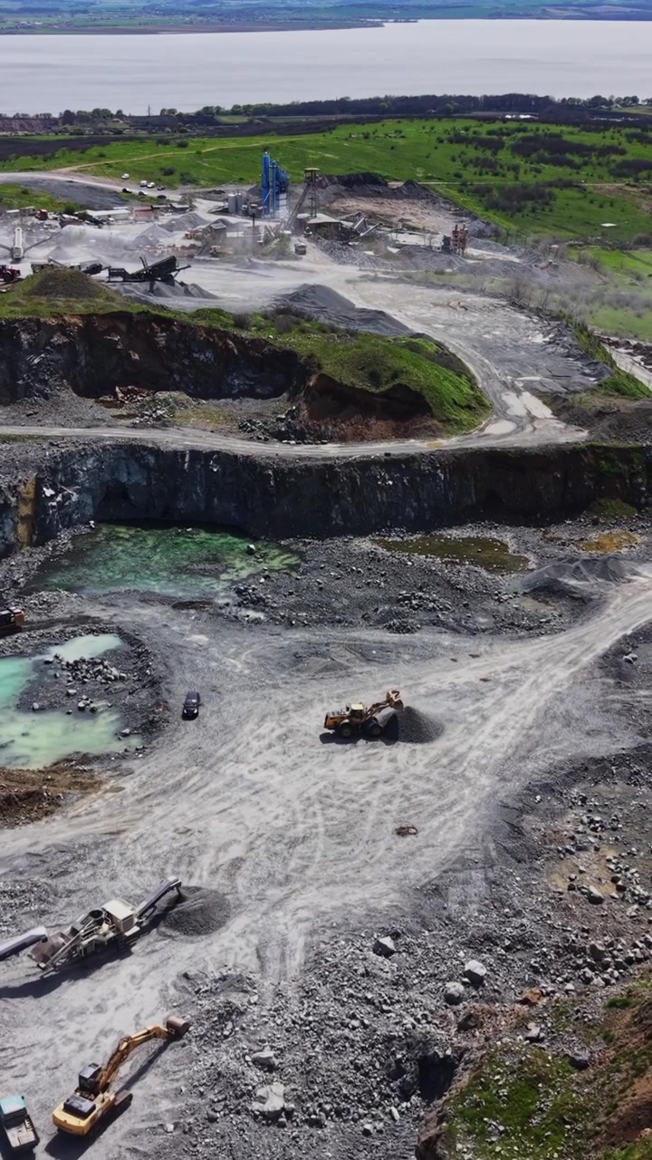 Detailed view of rock piles and conveyor systems aerial