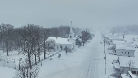 monson town covered in blanket of snow aerial