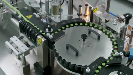 Top View Medical Ampoule Vaccine Mass Production Line In Modern Laboratory Pharmaceutical Factory. Glass Ampoules are being Filled. Medication Manufacturing Process.