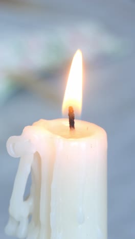 book with candles in front