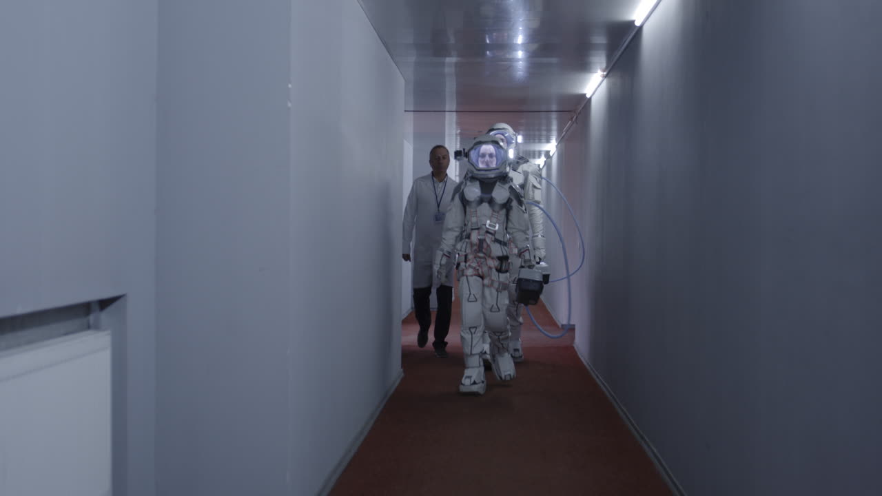 Astronauts and Scientists in a Futuristic Corridor