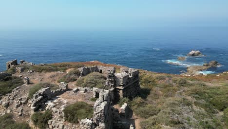 Stone remnants of medieval fort on Pessegueiro Island in Portugal