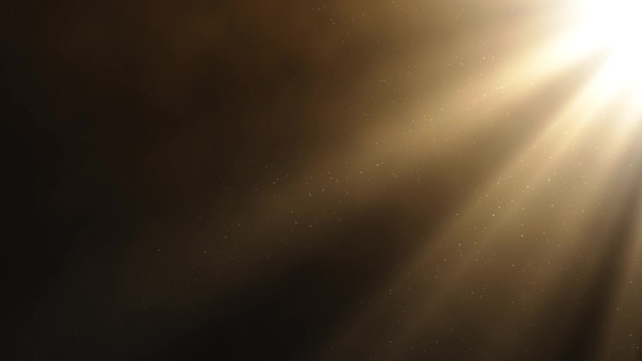 Dramatic golden light rays illuminating floating dust particles against a dark, atmospheric background, loopable animation