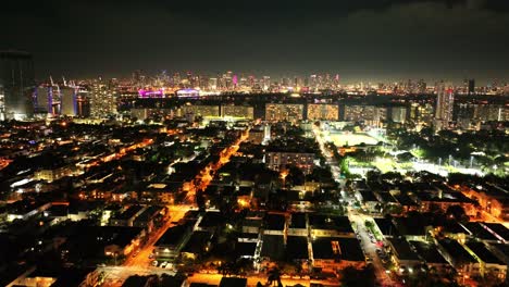 south beach miami florida at night drone view flying over the city