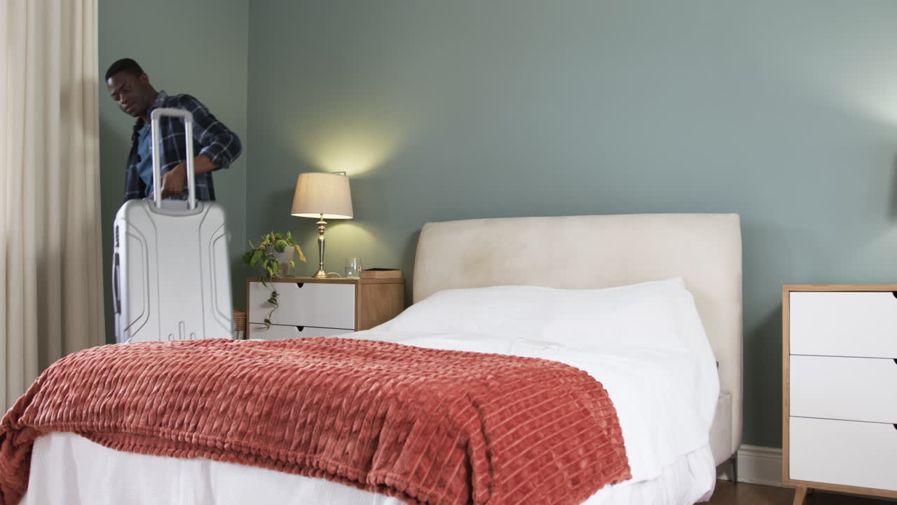 Cozy bedroom with soft lighting, plush blanket, and elegant bedside lamp, copy space