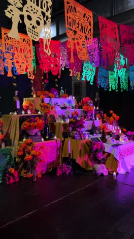day of the dead altar with typical mexican foods and colorful confetti decorating