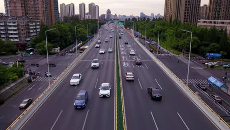 an aerial view of the busy hangzhou highway, revealing the fast-paced motion of cars, trucks, and buses