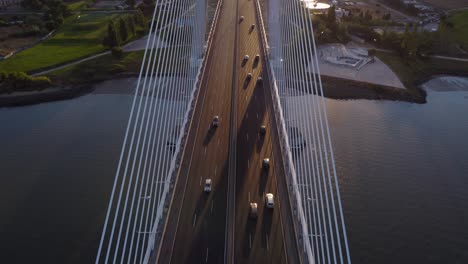 aerial fly-by reveal shot of vasco da gama bridge in lisbon, portugal