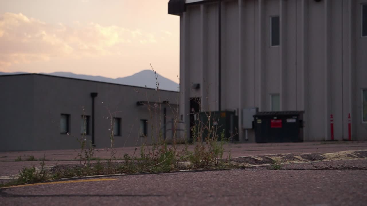 Teenager Performs an Ollie Skateboard Trick at Sunset