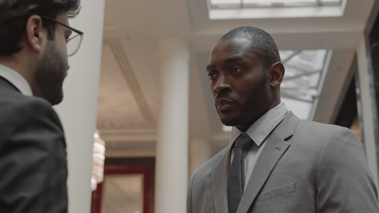 Business Person Talking to Colleague