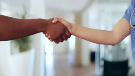 hospital, nurse and patient shaking hands