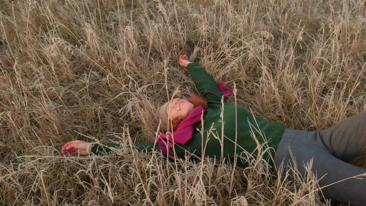 Woman relaxing in a field
