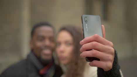 couple taking silly selfies together