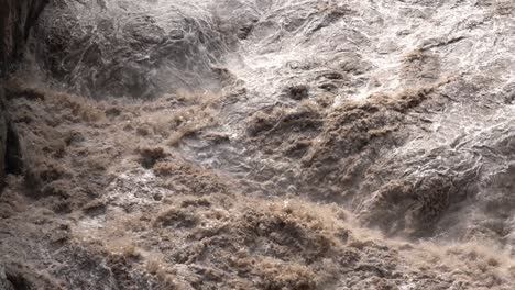 raging flooded river flowing in slow motion