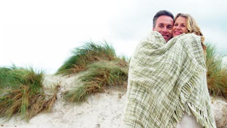 Romantic-couple-embracing-each-other-in-shawl