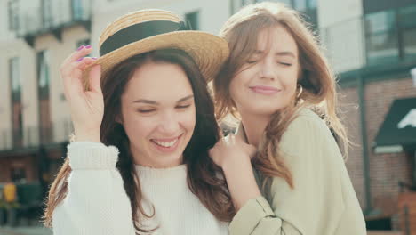 two happy women friends outdoors