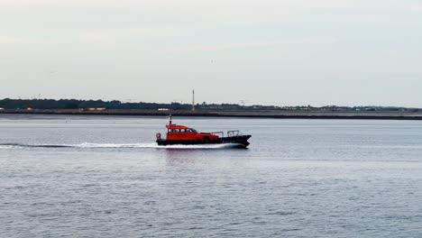 seafaring serenity: handheld following shot of dpc tolka leaving dublin port in the evening