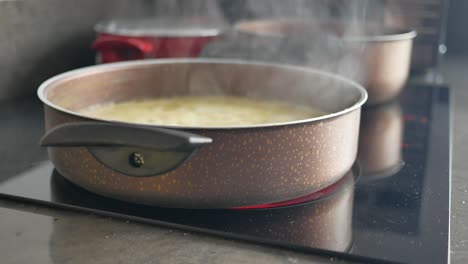 a pot of boiling water on a stovetop